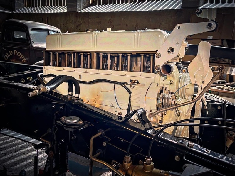 White petrol engine installed in a restored Bedford truck