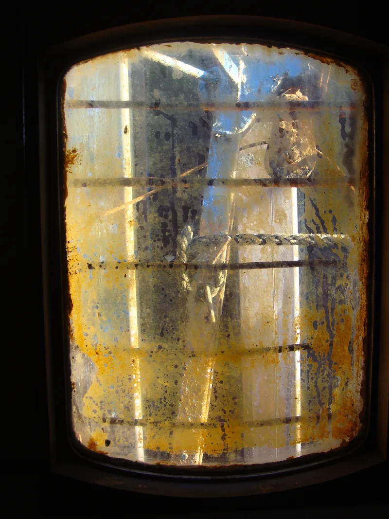 Dirty window inside a fishing trawler