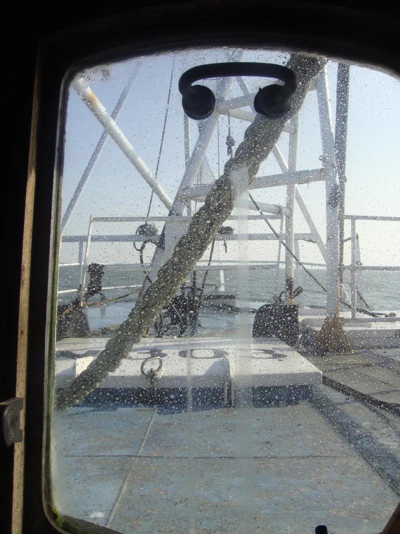 Looking through the window of a fishing trawler at sea