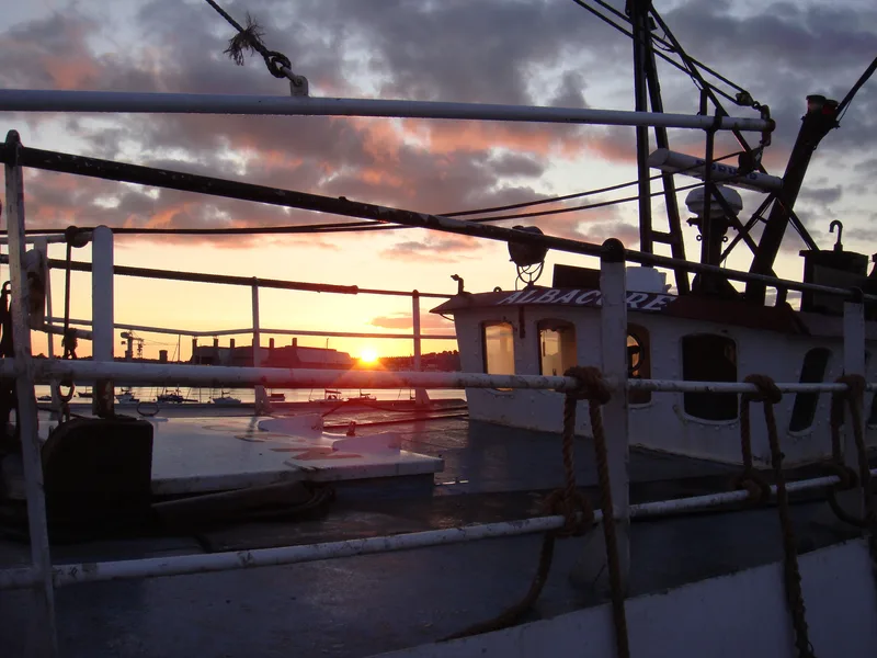 Sunset viewed from on deck a fishing trawler