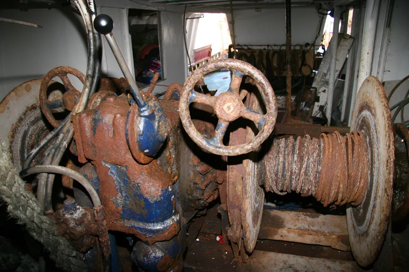 Old winch on board a wooden fishing trawler